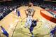 Anthony Davis leaps high on a dunk attempt.