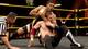 Angelo Dawkins battles Sami Zayn.