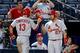 Matt Carpenter celebrates with Jhonny Peralta after scoring a run in a game against the Braves on May 8.