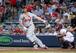Matt Holliday gets a hit in a game against the Braves on May 8.