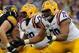 LSU left guard Vadal Alexander (center) blocks alongside left tackle La'el Collins (right).