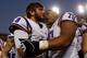 LSU left tackle La'el Collins (No. 70) embraces injured quarterback Zach Mettenberger after LSU's victory against Arkansas last season.