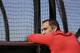 Cardinals GM John Mozeliak watches batting practice during spring training.