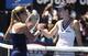 Dominika Cibulkova shakes hands with Simona Halep at the 2014 Australian Open