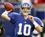 Fighting for his job, Manning threw his first career game-winning touchdown pass against a Denver Broncos team riding a five-game winning streak.