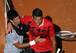 Novak Djokovic consoles Milos Raonic after their semifinals match in Rome.