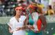 Li Na and Serena Williams chat during the 2014 Sony Open trophy ceremony.