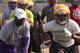 LSU running back coach and recruiting coordinator Frank Wilson gives instructions to LSU commit Nick Brossette (right).