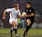 Doug Howlett runs around James Simpson-Daniel