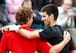 Novak Djokovic embraces a young Ernests Gulbis after defeating him in the 2008 French Open.