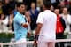 Novak Djokovic greets Jo-Wilfried Tsonga at the net after winning their match at the 2014 French Open.