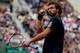 Ernest Gulbis gestures during his match against Tomas Berdych in the quarterfinals of the French Open.