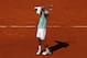 A disappointed Novak Djokovic reacts to losing to Rafael Nadal at the 2013 French Open.