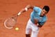 Novak Djokovic serves during his fourth-round match against Jo-Wilfried Tsonga at the 2014 French Open.