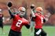 Johnny Manziel (2) and Brian Hoyer (6) are battling for the Cleveland Browns' starting quarterback job.