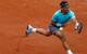 Rafael Nadal sprints toward the ball during a match at the 2014 French Open.