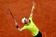 Andy Murray serves during a 2014 French Open match.