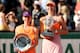 Simona Halep and Maria Sharapova pose during the trophy ceremony at the 2014 French Open.