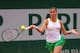 Flavia Pennetta hits a forehand during a match at the 2014 French Open.