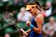 Ana Ivanovic fist pumps after winning a point during a match at the 2014 French Open.