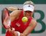 Angelique Kerber attacks the ball during a match at 2014 French Open.