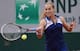 Dominika Cibulkova attacks the ball during a match at the 2014 French Open.