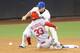 Cardinals infielder Daniel Descalso slides into second base against the New York Mets on April 22.