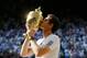 Andy Murray kisses trophy after winning the 2013 Wimbledon title.