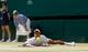 Novak Djokovic after he falls during a match at the 2013 Wimbledon Championships.