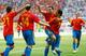 Xavi (centre, No 8) celebrates against Ukraine.