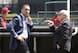 Cardinals GM John Mozeliak (left) watches batting practice before a game against Cincinnati on March 31.