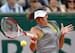 Ajla Tomljanovic hits a forehand during French Open match