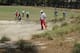 Jason Dufner (in red pants) wasn't the only big-name golfer in search of his golf ball often on Friday