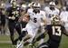 Central Florida quarterback Blake Bortles (5) dashes for a rushing touchdown as Baylor safety Terrell Burt (13) defends during the second half of the Fiesta Bowl NCAA college football game, Wednesday, Jan. 1, 2014, in Glendale, Ariz. (AP Photo/Rick Scuter
