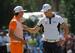 Martin Kaymer checks out Rickie Fowler's Sunday outfit.
