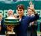 Roger Federer waves to the crowd after his victory in Halle.