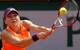 Simona Halep reaches for a backhand during the finals of the 2014 French Open.