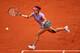 Li Na sprints to the ball during her first-round loss at the 2014 French Open.
