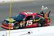 Clint Bowyer waves the checkered flag after winning at Sonoma in 2012.