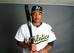 Addison Russell poses for spring-camp photos.