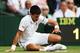 Novak Djokovic gets up from a fall during his second-round match at Wimbledon.