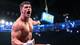 Cody Rhodes points to the Money in the Bank briefcase hanging high above the ring.