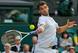 Grigor Dimitrov hits a forehand during a match at Wimbledon.