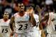 Cincinnati guard Sean Kilpatrick high-fives a teammate.