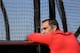 Cardinals GM John Mozeliak watches batting practice during Spring Training 2014.