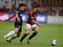 Mattia De Sciglio battles Inter's Yuto Nagatomo.