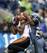 Green maintains his focus and catches the ball despite Thomas' defense