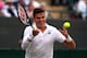 Milos Raonic targets the ball during his quarterfinal match at Wimbledon.