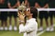 Roger Federer kisses Wimbledon trophy after winning the title in 2012.