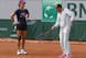 Li Na listens to former coach Carlos Rodriguez.